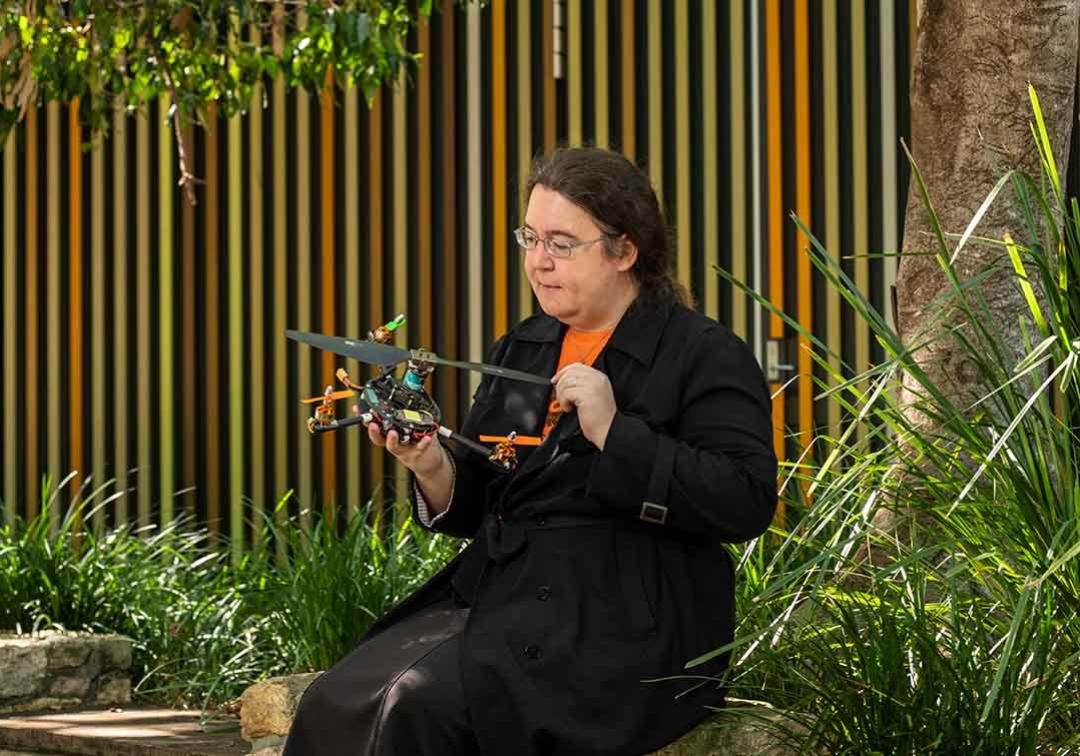Dr Pauline Pounds holds a quadroter, which looks a little like a drone